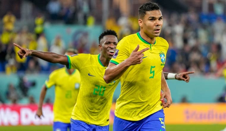 Brazil's Casemiro, right, celebrates after scoring goal against Switzerland | AP