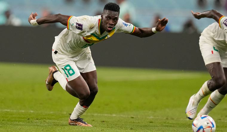 Senegal's Ismaila Sarr aims for the ball during their match against Ecuador | AP