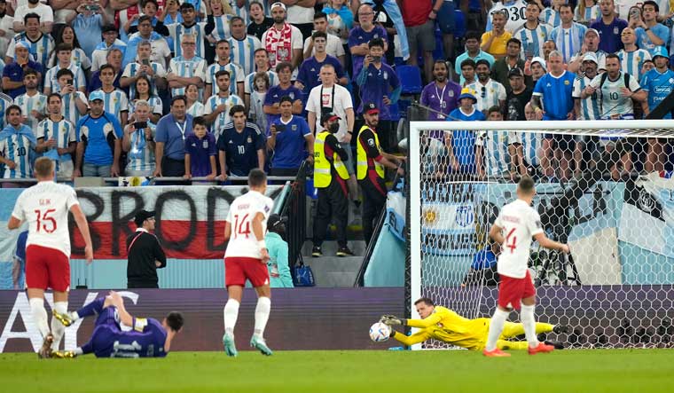 Messi and Argentina advance at World Cup, beat Poland 2-0