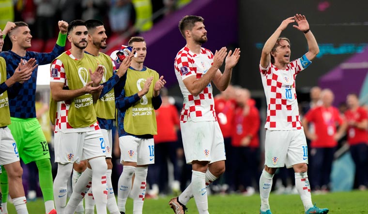 Croatia's Luka Modric, right, and teammates acknowledge the fans at the end of the World Cup group F match against Belgium | AP