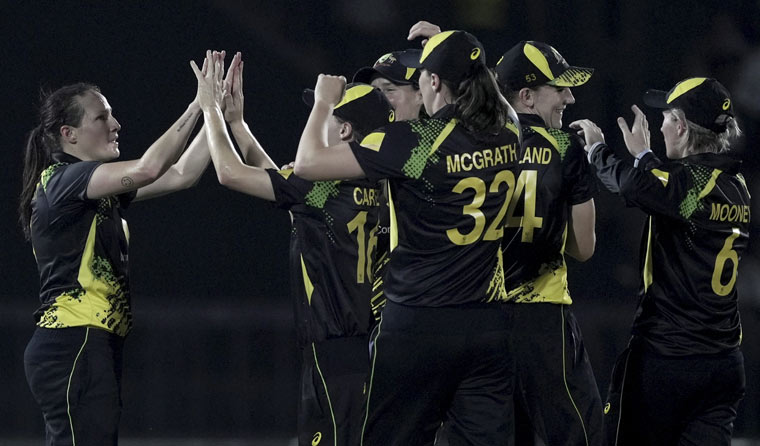 Australian player Megan Schutt celebrates with teammates the wicket of India's player Harmanpreet Kaur | PTI