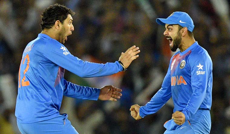[File] Yuvraj Singh and Virat Kohli celebrate a wicket during the 2016 T20 World Cup match against Australia in Mohali | Salil Bera