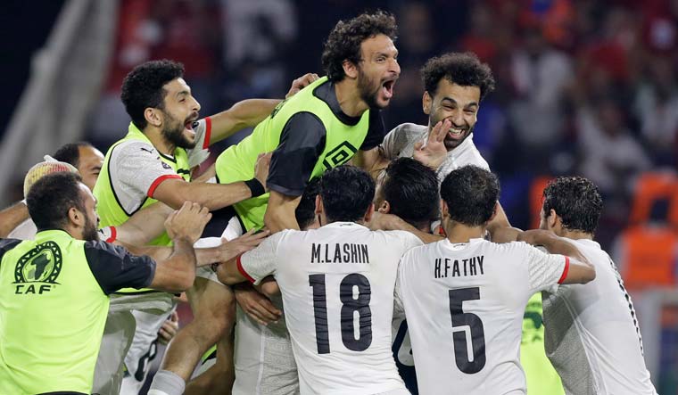 Egypt players celebrate after a penalty shootout during the African Cup of Nations 2022 semifinal against Cameroon | AP