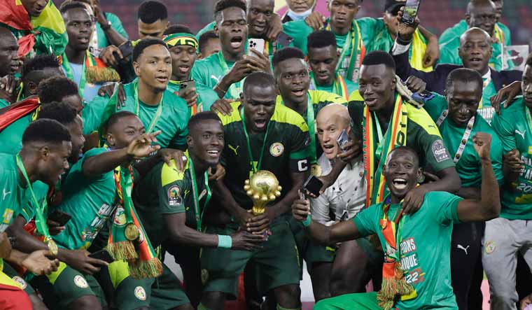 Senegal players lift the African Cup of Nations trophy after beating Egypt in the final | AP