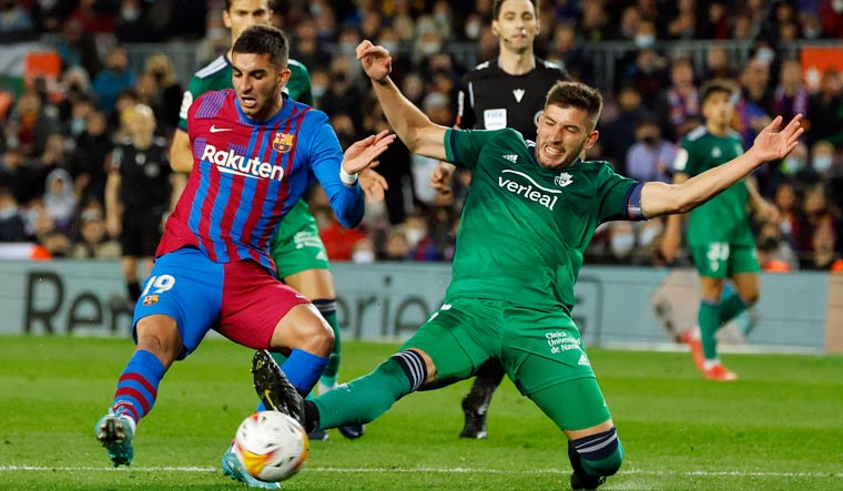 LaLiga - FC Barcelona v Osasuna - Camp Nou, Barcelona, Spain - March 13, 2022 FC Barcelona's Ferran Torres in action with Osasuna's David Garcia | Reuters