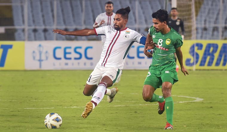 ATK Mohun Bagan FC and Maziya Sports & Recreation Club players vie for the ball during their AFC Cup group stage match, in Kolkata | PTI