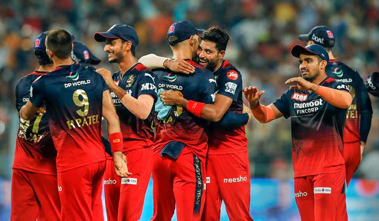 Royal Challengers Bangalore celebrate after winning their Indian Premier League 2022 Eliminator cricket match against Lucknow Super Giants, at Eden Gardens in Kolkata, Wednesday, May 25, 2022 | PTI