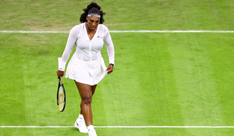 Tennis - Wimbledon - All England Lawn Tennis and Croquet Club, London, Britain - June 28, 2022Serena Williams of the U.S. reacts after losing her first round match against France's Harmony Tan REUTERS/Hannah Mckay