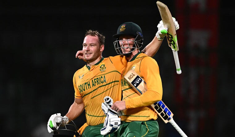 South Africa's Rassie van der Dussen (R) and David Miller celebrate after winning the first T20I match against India, at the Arun Jaitley Stadium in New Delhi | AFP