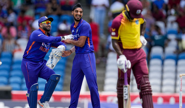 [File] India's Arshdeep Singh celebrates with wicket keeper Rishabh Pant the dismissal of West Indies' Kyle Mayers during the first T20 cricket match | AP