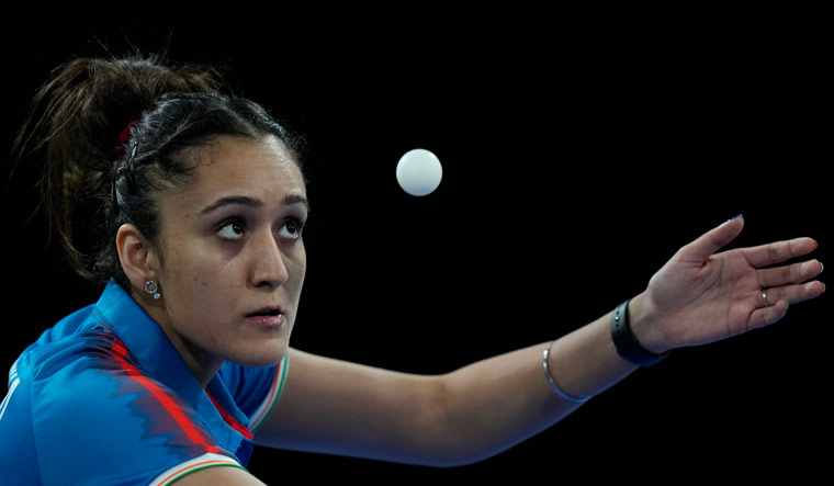 Manika Batra competes against South Africa's Musfiquh Kalam during the women's team table tennis event at the Commonwealth Games in Birmingham | AP