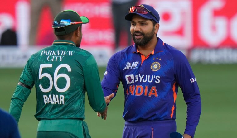 India's captain Rohit Sharma, right, shake hands with Pakistan captain Babar Azam after the toss | AFP