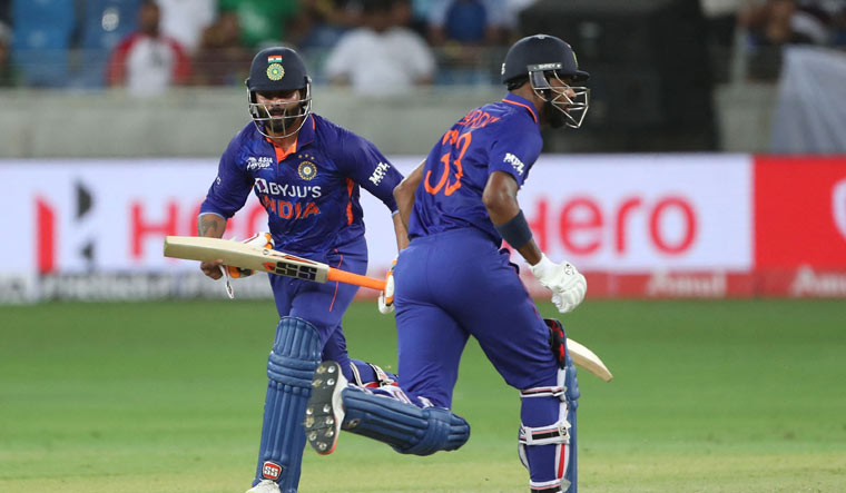 Ravindra Jadeja (L) and Hardik Pandya take a run | AFP