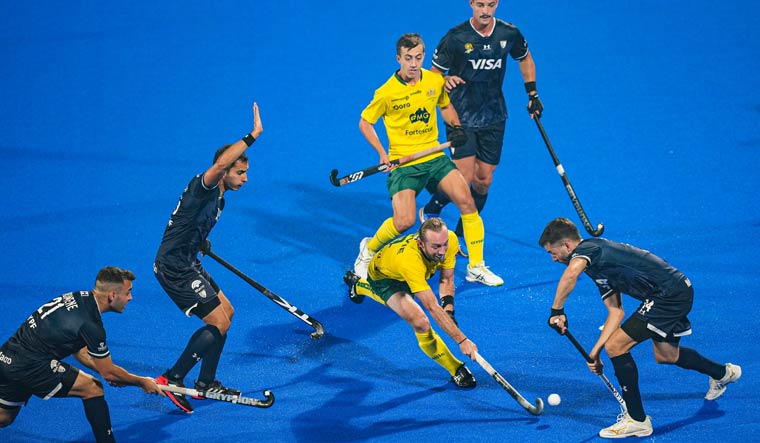 Australia and Argentina players in action at the Hockey Men's World Cup 2023 Pool A match, at Kalinga Hockey stadium in Bhubaneswar | PTI