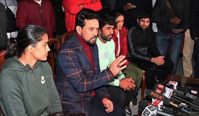 Union Sports Minister Anurag Thakur with wrestlers Bajrang Punia, Vinesh Phogat, Babita Phogat, Sakshi Malik and Ravi Dahiya addresses a press conference at his residence in Delhi on Saturday morning | PTI
