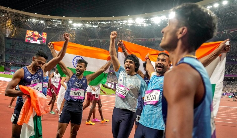 old and silver medalists Indian javelin throwers Neeraj Chopra and Kishore Kumar Jena celebrate with the gold medalist Indian Mens Relay team | PTI