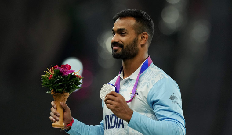  Silver medalist India's Kishore Kumar Jena during the presentation ceremony | PTI