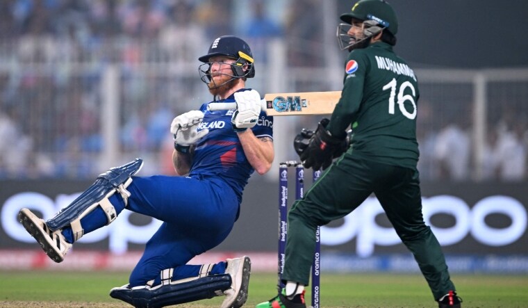 England's Ben Stokes falls after playing a shot as Pakistan wicketkeeper Mohammad Rizwan watches | AFP