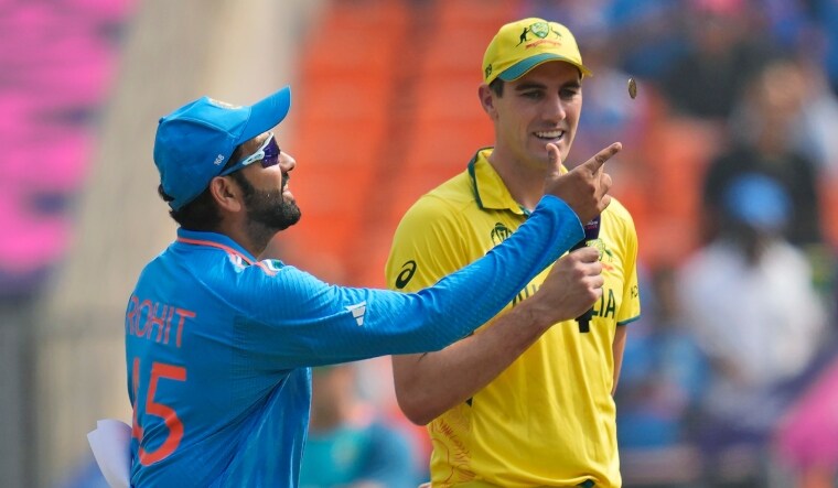 Indian captain Rohit Sharma tosses the coin up in the air as Australia's captain Pat Cummins | AP