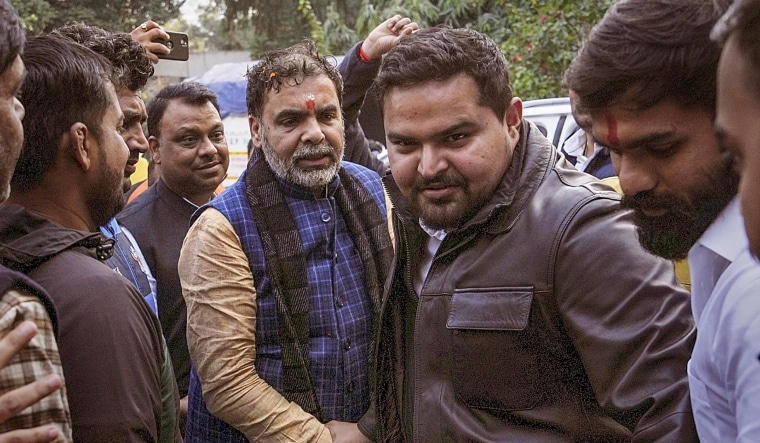Newly-elected president of WFI Sanjay Singh with son of BJP MP Brij Bhushan Sharan Singh's son Prateek Bhushan Singh | PTI