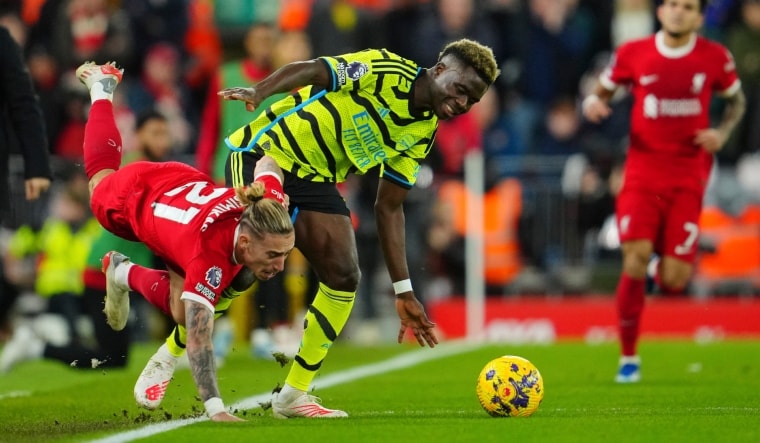 Liverpool's Kostas Tsimikas (L) getting injured during the game against Arsenal | AP