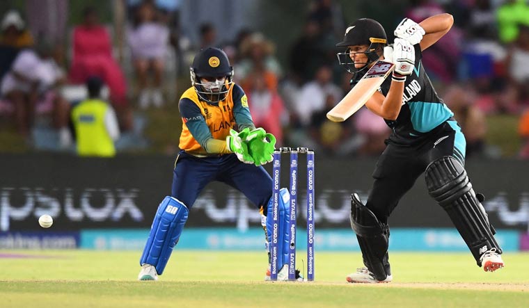 New Zealand's Suzie Bates (R) plays a shot as Sri Lanka's wicketkeeper Anushka Sanjeewani (L) reacts during the Group A T20 women's World Cup match, in Paarl | AFP