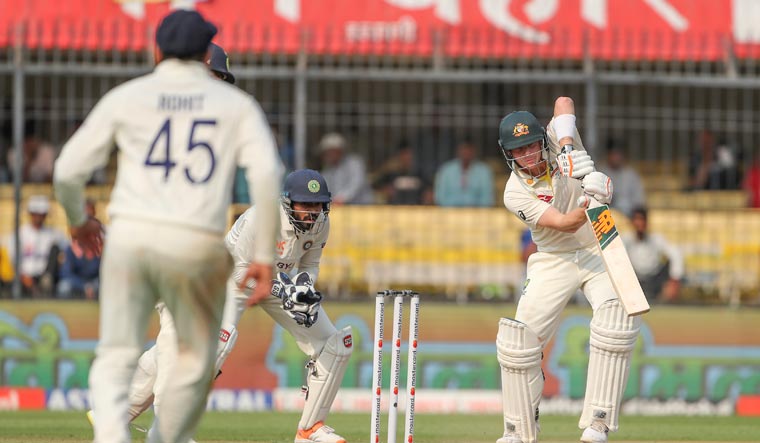 Australia's captain Steve Smith, right, plays a shot | AP