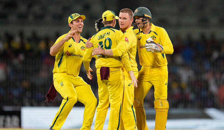 Australia's Adam Zampa, second right, celebrates with teammates after the dismissal of India's Hardik Pandya | AP
