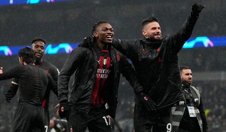 AC Milan's players celebrate at the end of the Champions League round of 16 second leg match against Tottenham Hotspur, in London | AP