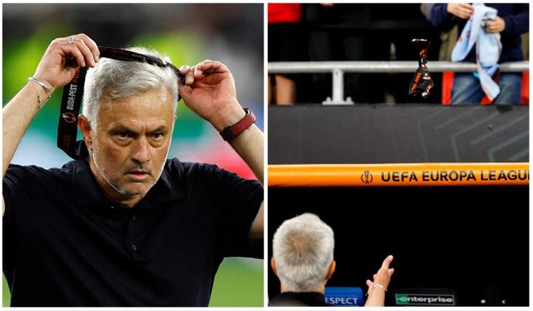 AS Roma coach Jose Mourinho gives away his medal to a young fan in the crowd after his side's loss to Sevilla in the Europa League final | Reuters; AFP