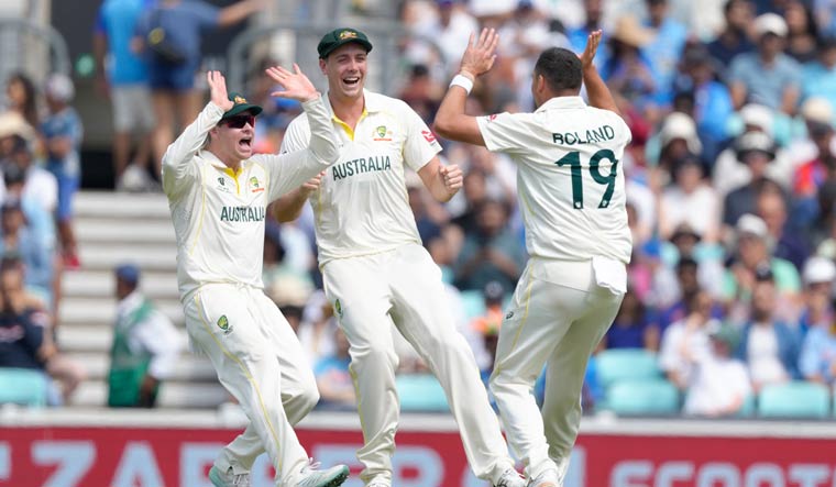 Australia's Scott Boland, right celebrates with teammates after taking the wicket of India's Ravindra Jadeja | AP