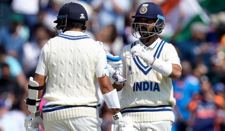 India's Ajinkya Rahane, right, reacts to India's Shardul Thakur after scoring 50 runs on the third day of the ICC World Test Championship Final between India and Australia at The Oval cricket ground in London, Friday, June 9, 2023. (AP Photo/Kirsty Wigglesworth)(AP06_09_2023_000130B)