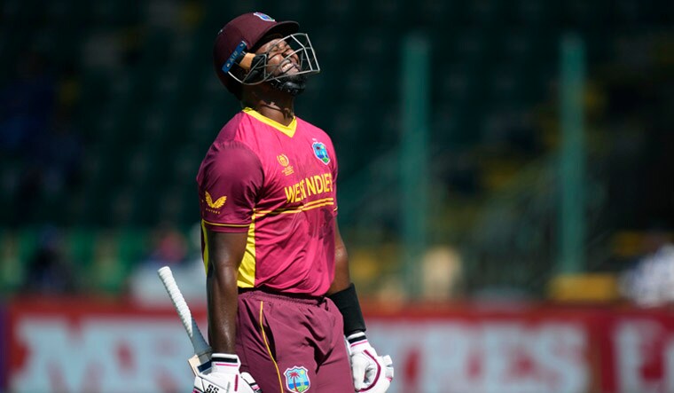 West Indies' Romario Shepherd reacts after been dismissed, during the CC Men's Cricket World Cup Qualifier match between the West Indies and Scotland, at Harare Sports Club, in Harare, Zimbabwe, Saturday, July 1, 2023. (AP Photo/Tsvangirayi Mukwazhi)
