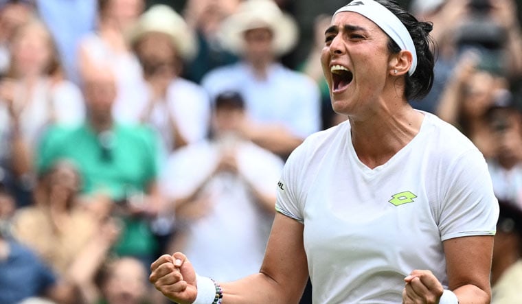 Tunisia's Ons Jabeur celebrates beating Kazakhstan's Elena Rybakina during their women's singles quarterfinals match in Wimbledon | AFP