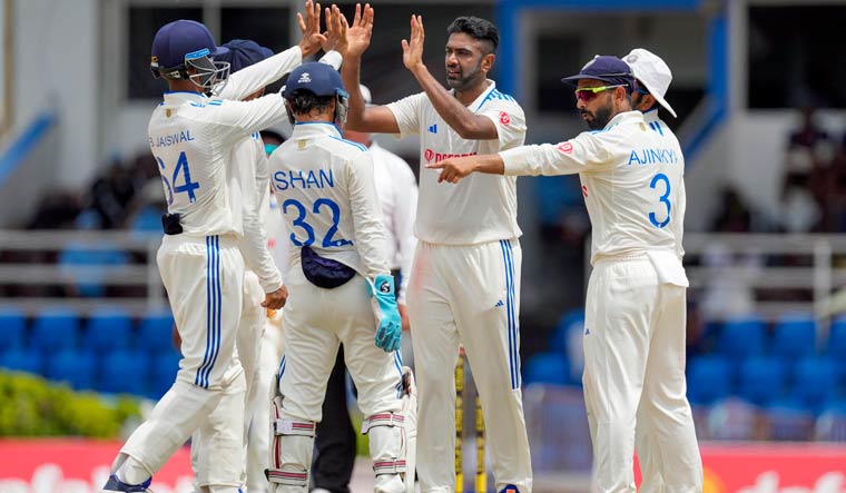 India's Ravichandran Ashwincelebrates with teammates after he bowled West Indies' capitan Kraigg Brathwaite on day three of their second cricket Test match at Queen's Park in Port of Spain, Trinidad and Tobago, Saturday, July 22, 2023 | PTI