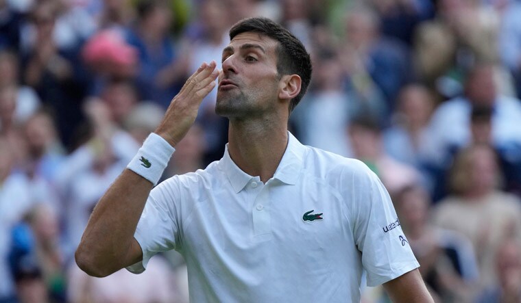 Serbia's Novak Djokovic celebrates defeating Australia's Jordan Thompson in the men's singles match on day three of the Wimbledon tennis championships in London, Wednesday, July 5, 2023. AP/PTI(AP07_06_2023_000006A)