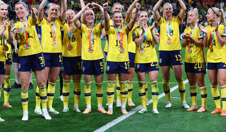 Sweden gesture to supporters as they celebrate with their bronze medals after defeating Australia in the Women's World Cup third place playoff soccer match in Brisbane, Australia, Saturday, Aug. 19, 2023. AP/PTI(AP08_19_2023_000086A)