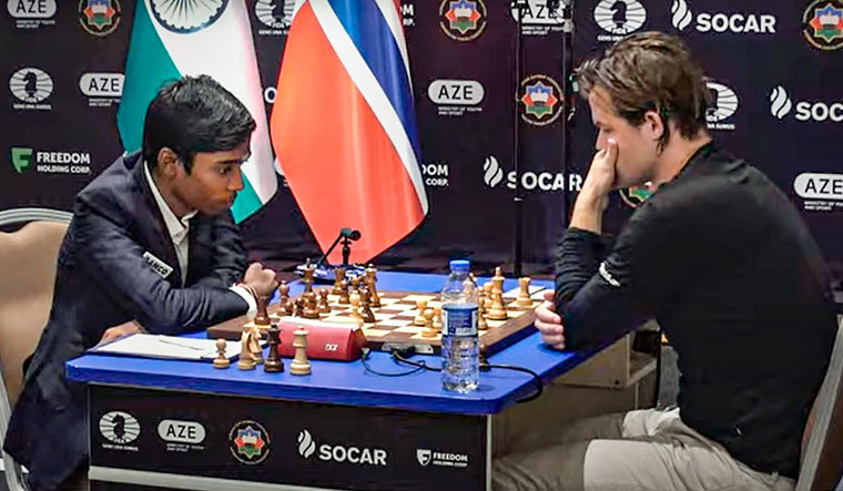 Indian Grandmaster R. Praggnanandhaa and Norway's Grandmaster and World No. 1 player Magnus Carlsen during the second match of the Chess World Cup 2023 final, in Baku | PTI