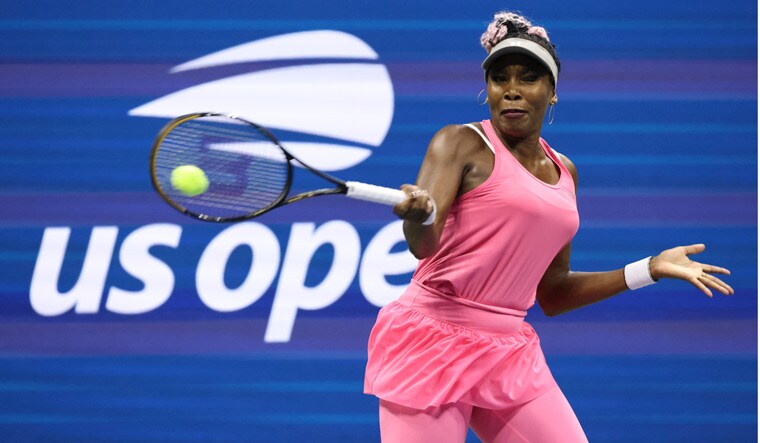 Venus Williams returns a shot to Greet Minnen, of Belgium, during the first round of the U.S. Open tennis championships |  AP
