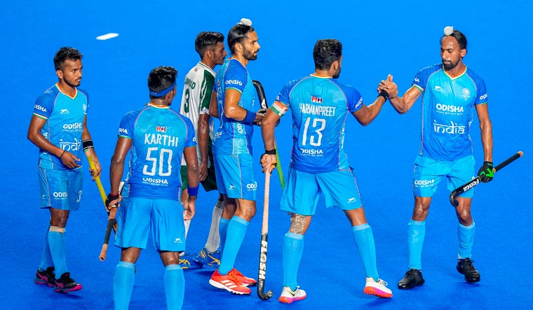 India's captain Harmanpreet Singh celebrates with teammates after scoring the 2nd goal against Pakistan | PTI