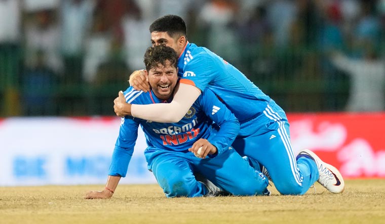 Kuldeep Yadav is embraced by Shubman Gill as they celebrate the wicket of Pakistan's Iftikhar Ahmed | AP