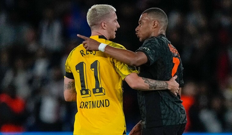 Dortmund's Marco Reus (L) congratulates PSG's Kylian Mbappe after their Champions League group clash. | AP