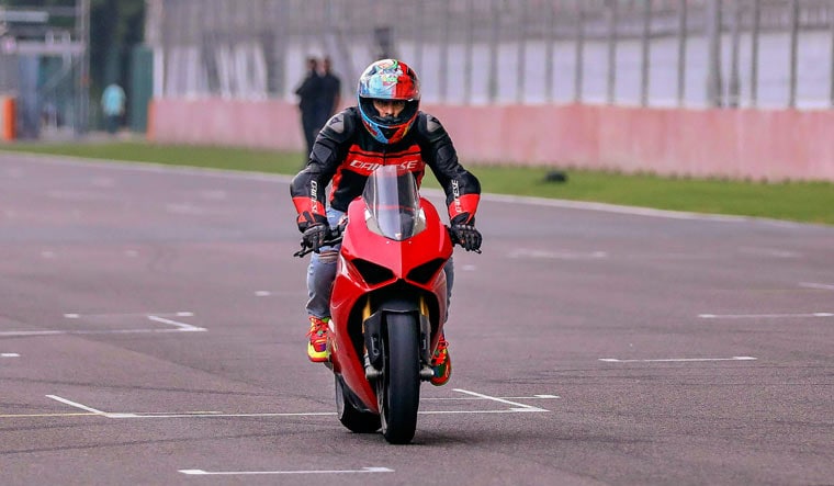 Actor Rannvijay Singh rides a bike at the Buddh International Circuit ahead of the MotoGP, in Greater Noida | PTI