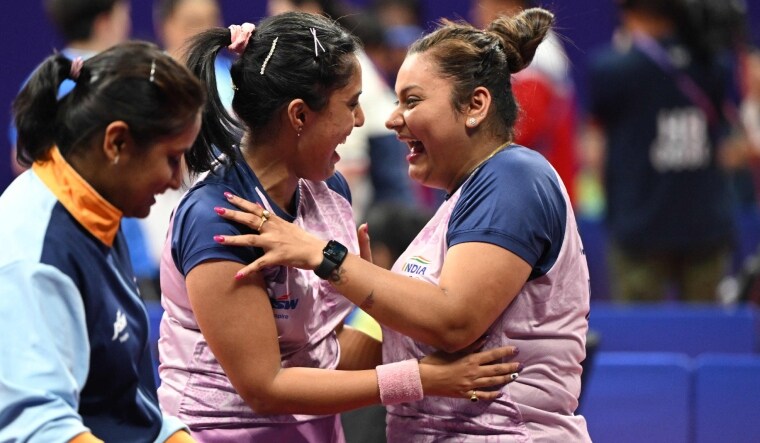 India's Sutirtha Mukherjee (R) and Ayhika Mukherjee (C) celebrate their win against China's Chen Meng and Wang Yidi | AFP