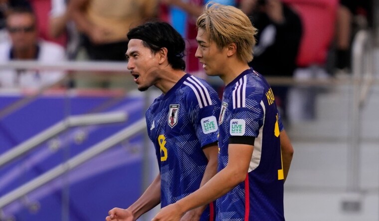 Japan's Takumi Minamino (L) celebrates with teammate Keito Nakamura after scoring | AP