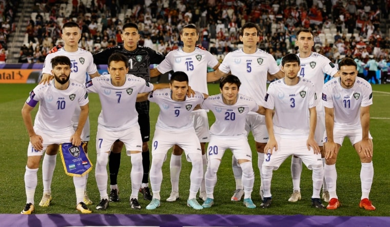 Uzbekistan players pose for a team group photo | Reuters