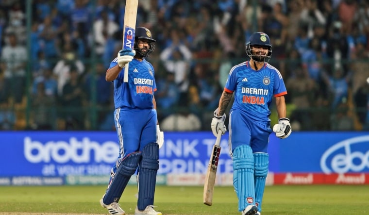 Rohit Sharma celebrates his 100 runs as teammate Rinku Singh looks on | AP