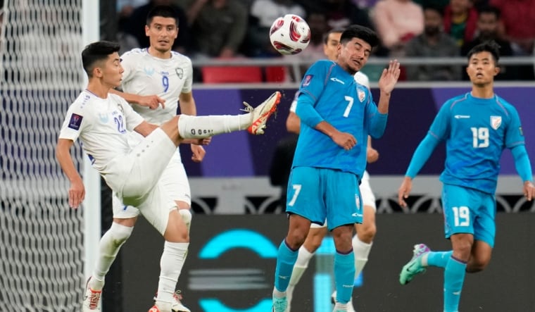 Uzbekistan Abbosbek Fayzullaev (in white) kicks the ball near India's Anirudh Thapa | AP
 

