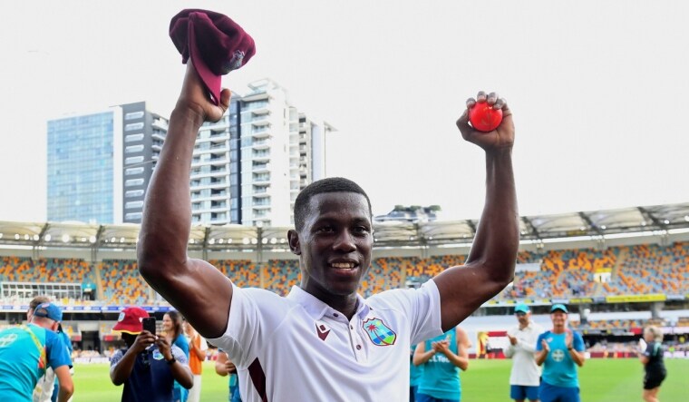 West Indies's Shamar Joseph raises the ball after taking 7 wickets against Australia | AP 