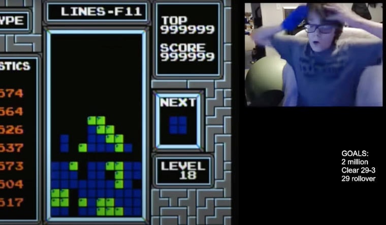 A screengrab shows Willis Gibson reacting after becoming the first player to officially “beat” the original Nintendo version of the game, Tetris. Technically, he made it to what gamers call a “kill screen,” a point where the Tetris code glitches, crashing the game | AP